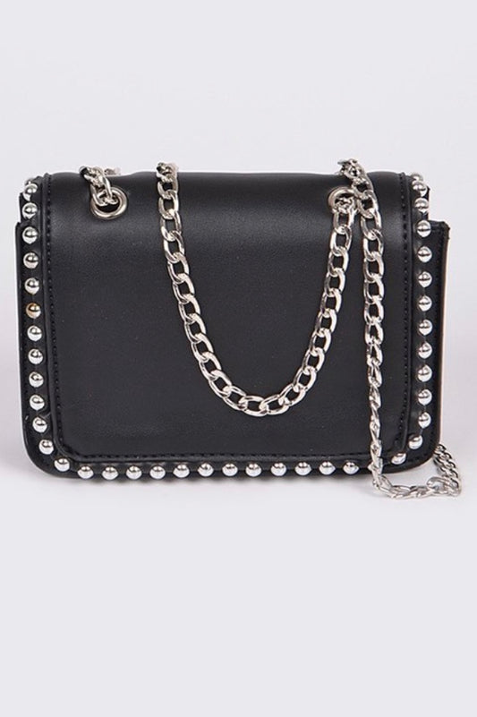 Women’s mini purse it is black with silver studs and silver chains.